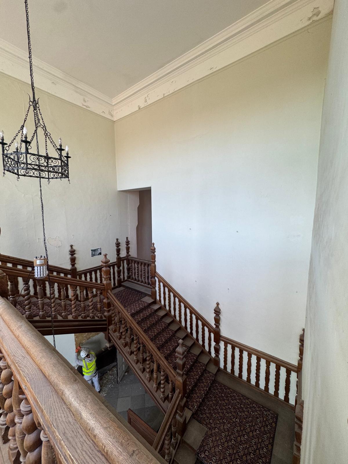 Bramshill House staircase landing with chandelier